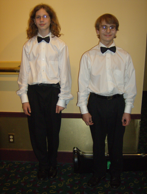 The taller boy on the left is the trombonist, the older boy on the right is the trumpeter, so handsome in their concert attire!