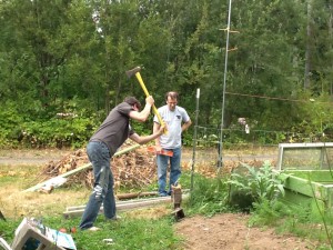 Grant swings to set the fencepost in place