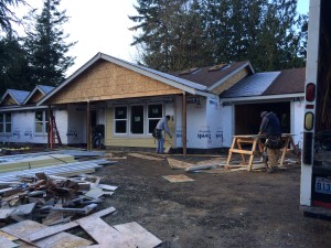 front of house with partial siding on