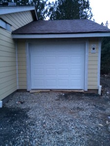 single-car garage and door. Not a lot of space, but enough.