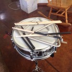 7" deep snare drum (used) with two different types of wooden sticks, a pair of wire brushes, two triangles with a striker.  Not shown:  two books with drum patterns to learn...